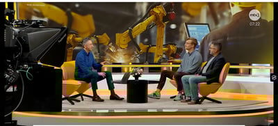 Three people in a tv studio